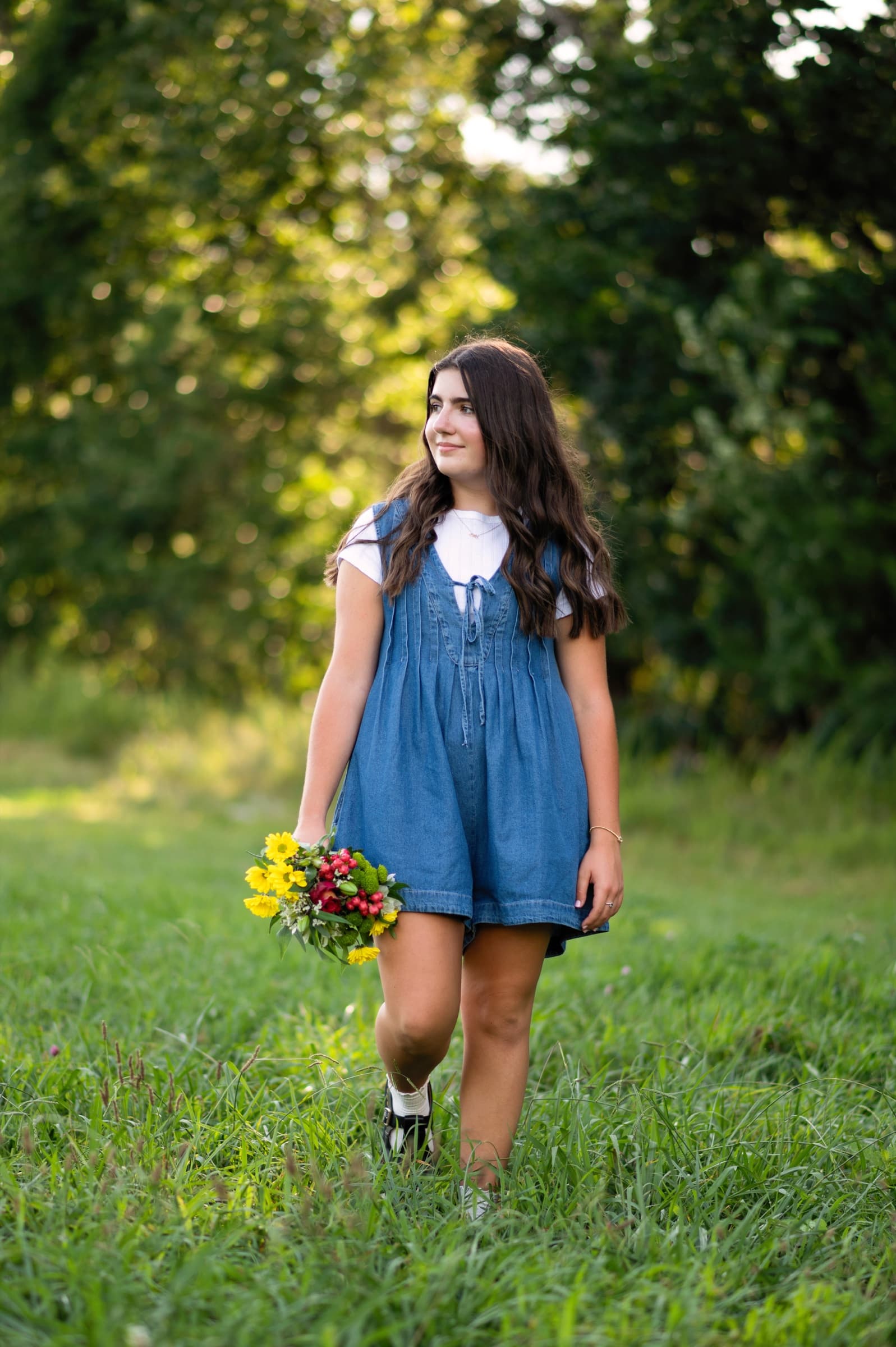 Senior portrait holding a colorful bouquet
