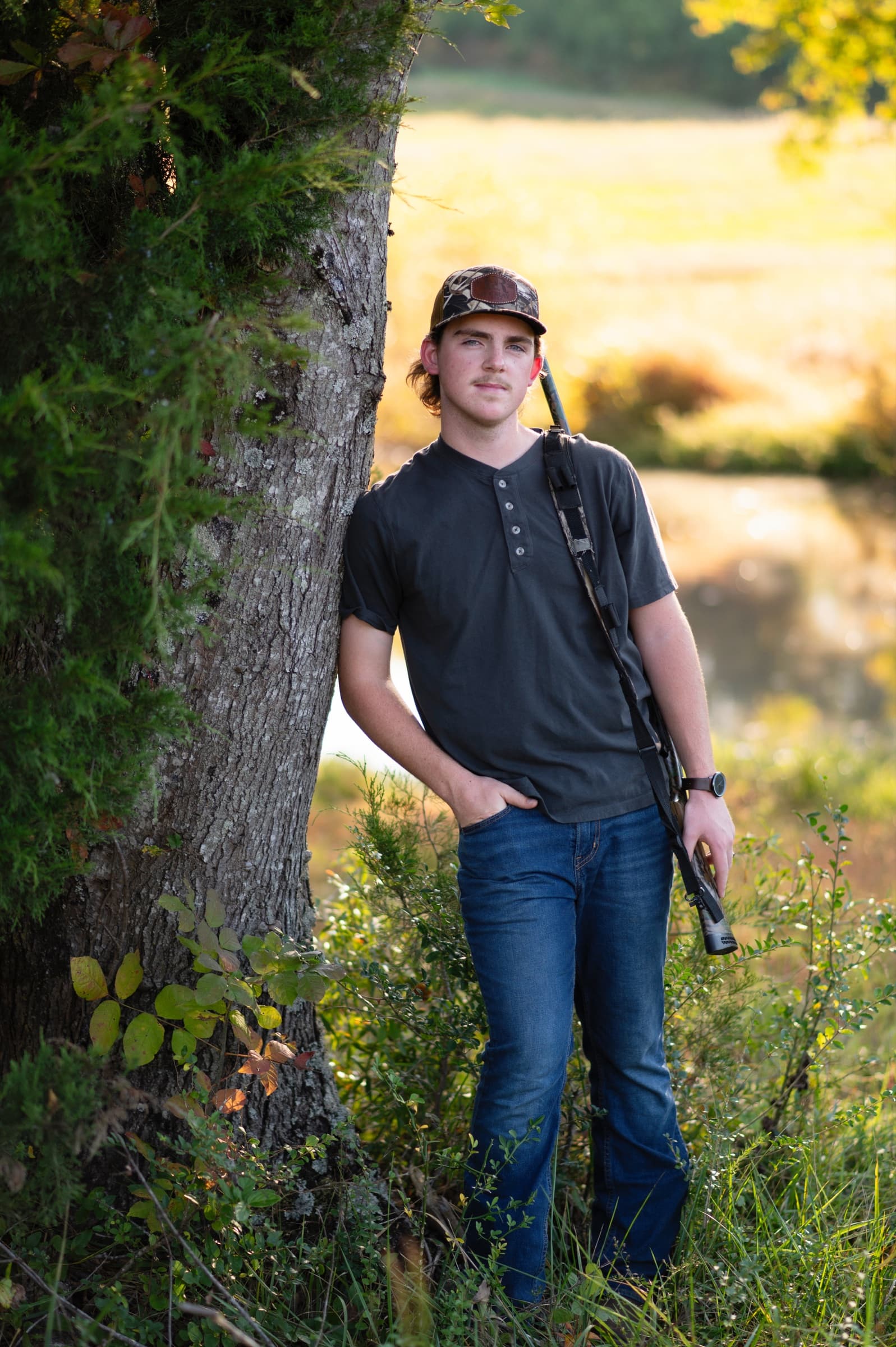 Senior boy portrait in a natural setting