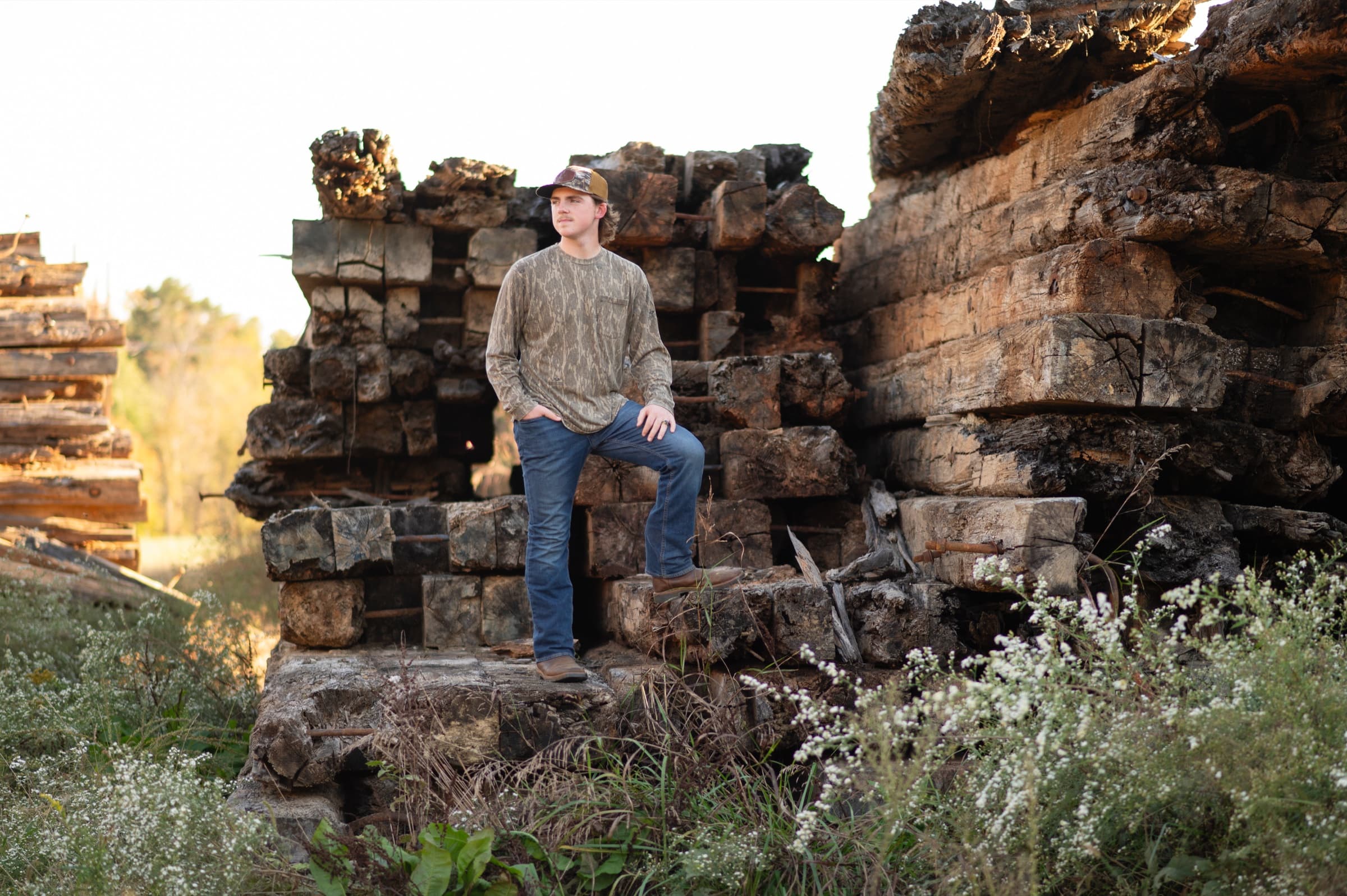 Senior boy portrait among historic stonework