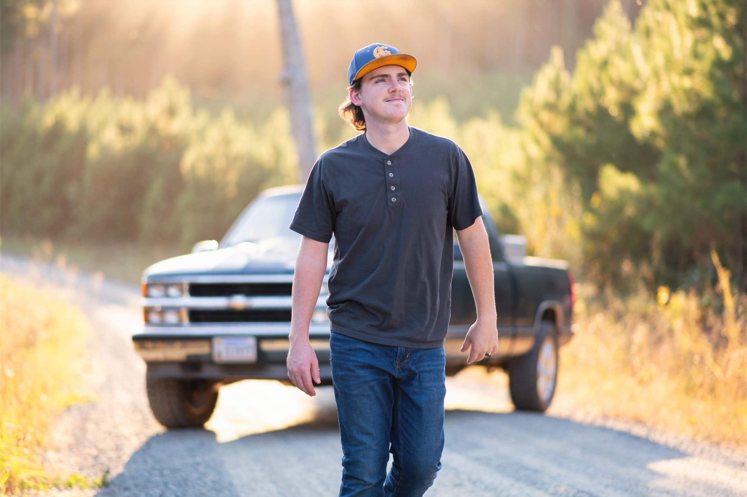 Senior boy portrait with a vintage truck