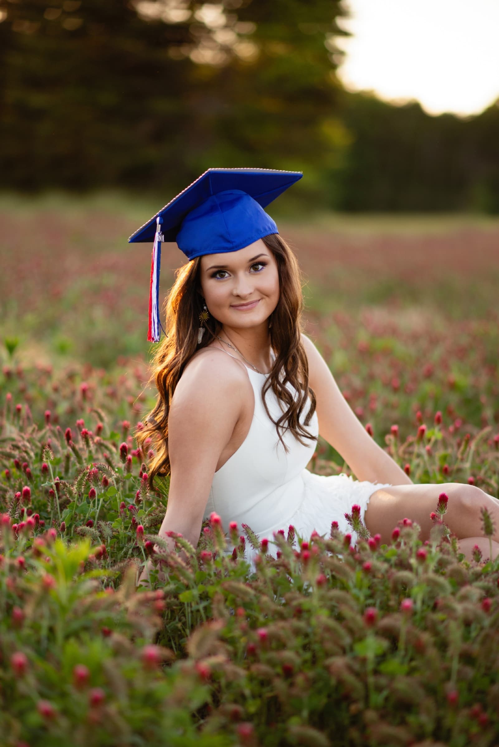 Graduation portrait in a wildflower field