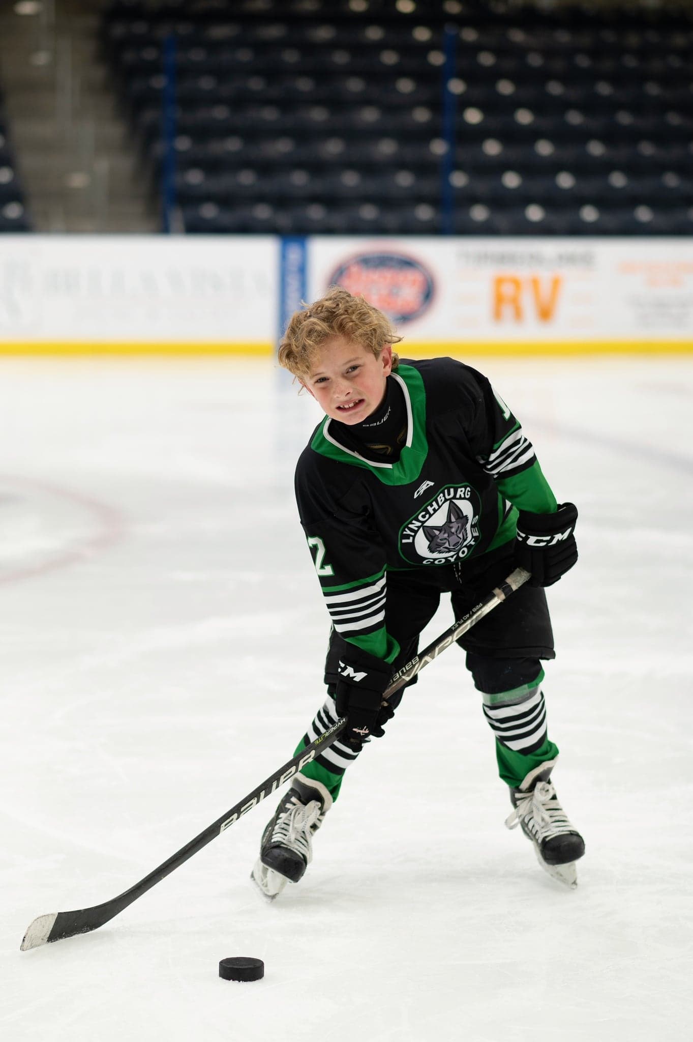 Coyotes player mid-stride on the ice