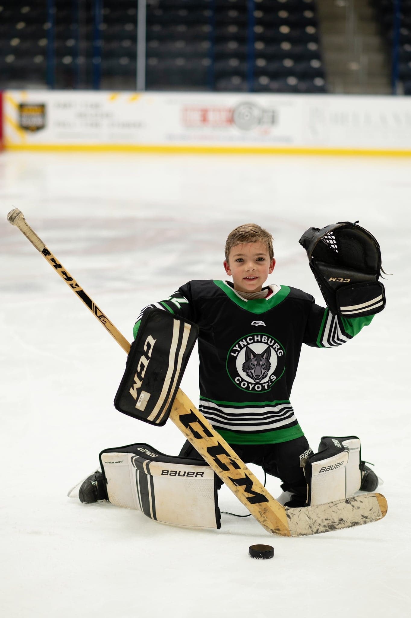 Coyotes goalie kneeling with blocker and glove up